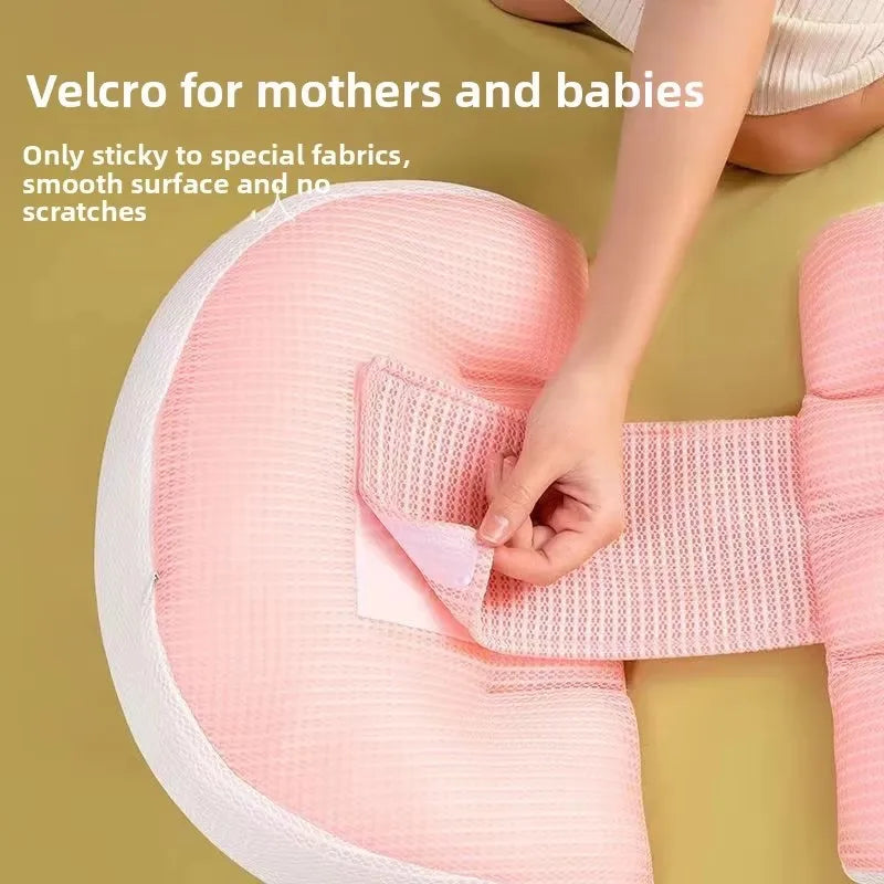 Pregnancy support pillow shown in pink color